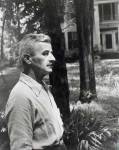 a man standing in front of trees